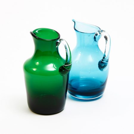 green and blue blown glass jugs