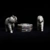 front view of vintage mother of pearl elephants and abalone trinket box on black background