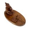 carved wood snake charmer from above