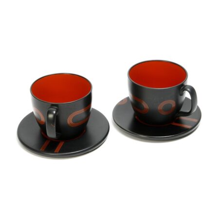 large black and red cup and saucer