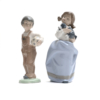 Boy with football and Girl with puppy NAO Figurines by Lladro 1988