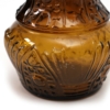 close up of dabs of portugal amber glass bottle